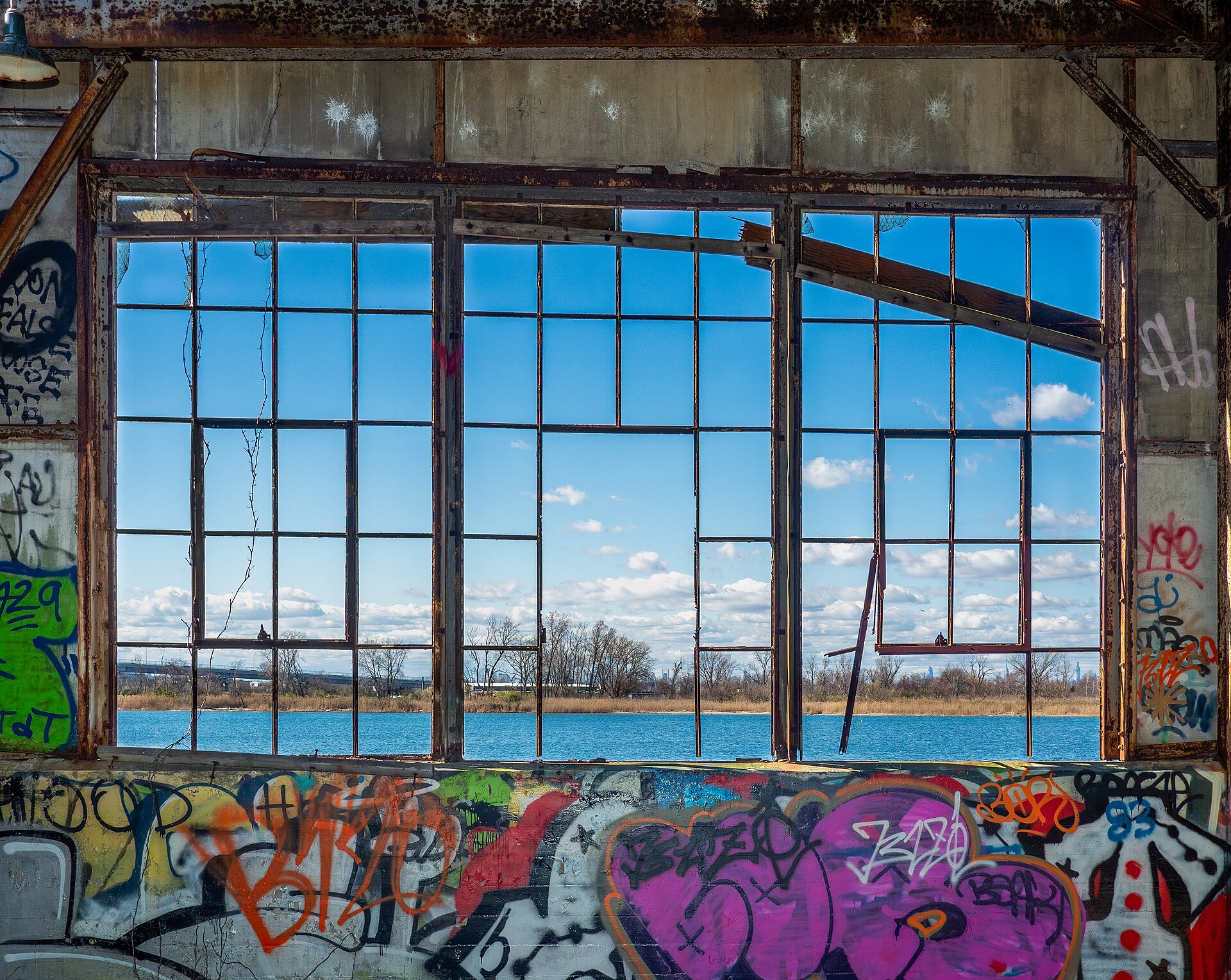 A derelict building with a window frame overlooking water, representing the challenges of building an online community.